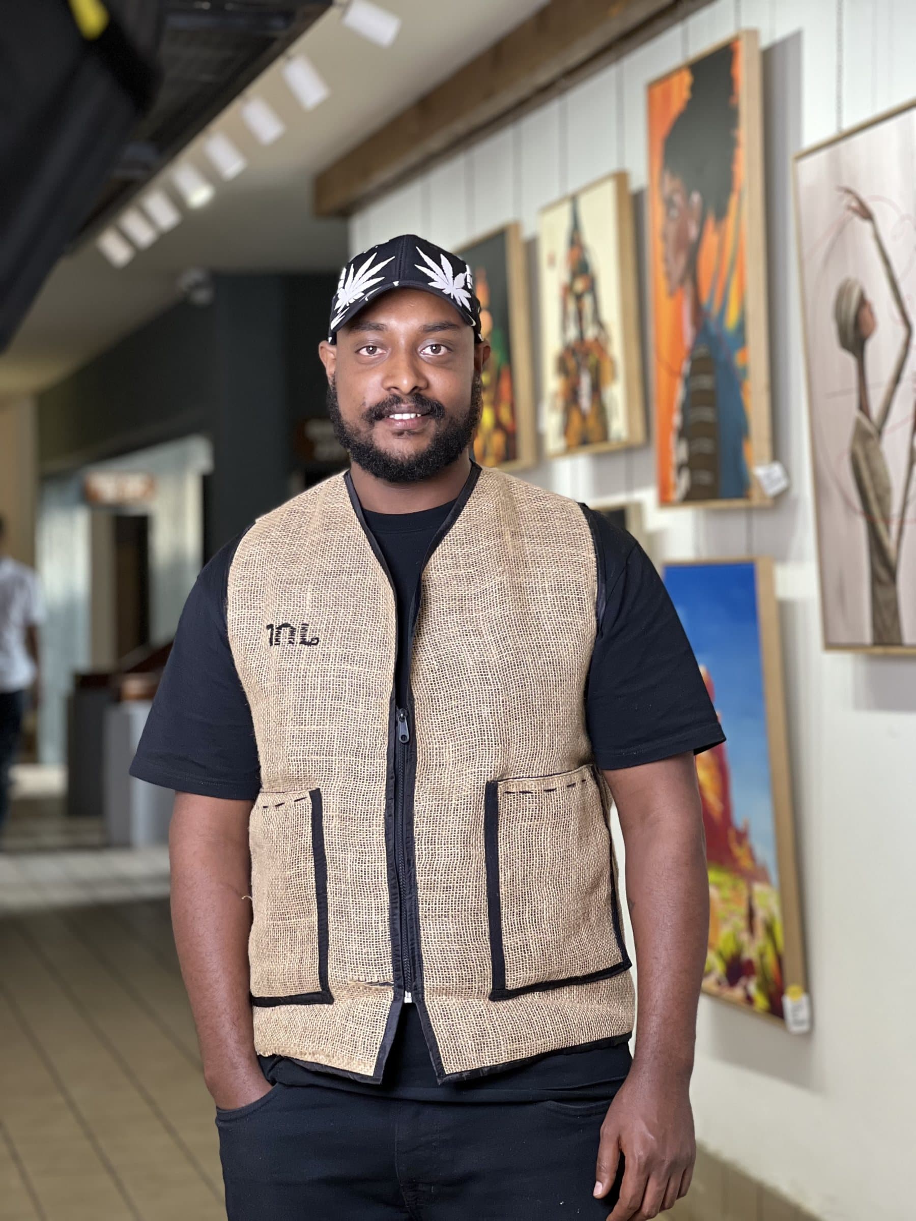 Tajur standing in a gallery